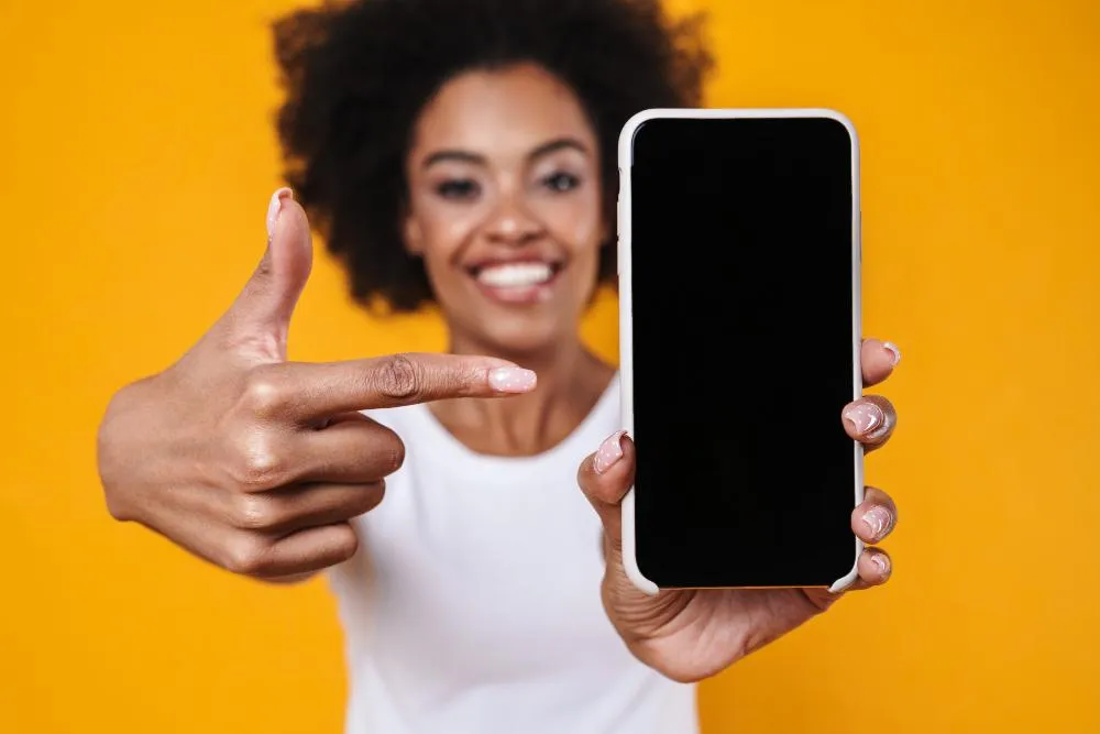 Happy African American Woman Smiling And Pointing