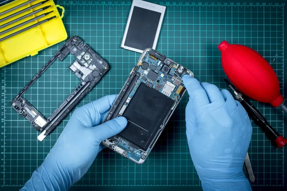 Technician Equipment Repair Inside Of Smart Phone