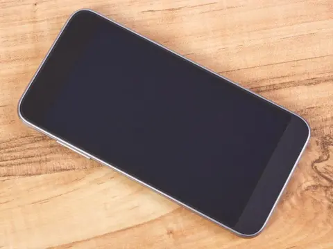 Smartphone with a blank screen resting on a table